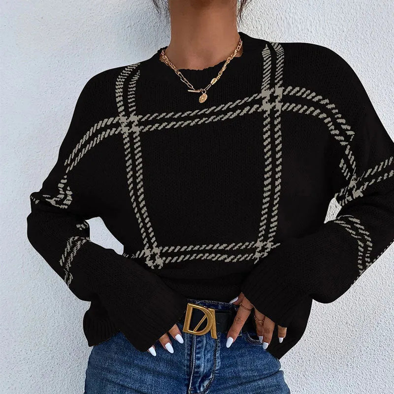 Women's loose-fit plaid sweater with colour-block stripes in apricot, black, beige, red, and green.