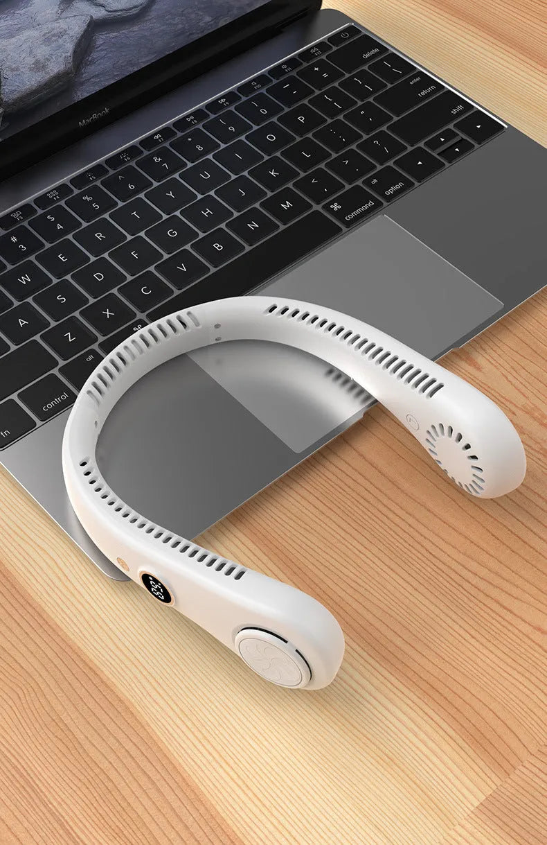 White bladeless neck fan hanging around neck with USB charging cable