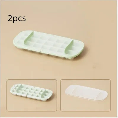 High capacity blue ice cube tray with ice grid and attached storage for the included shovel.
