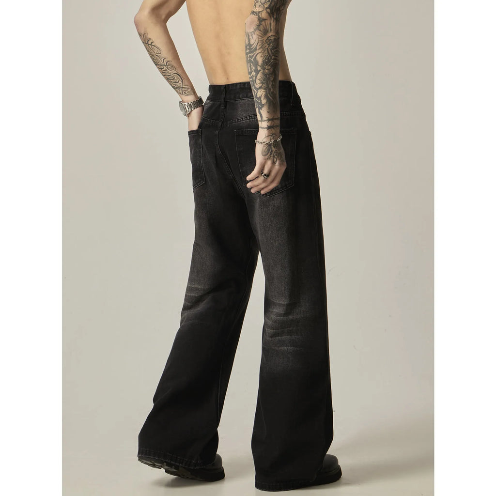 Black loose-fit straight-leg retro jeans with a zipper fly on a mannequin