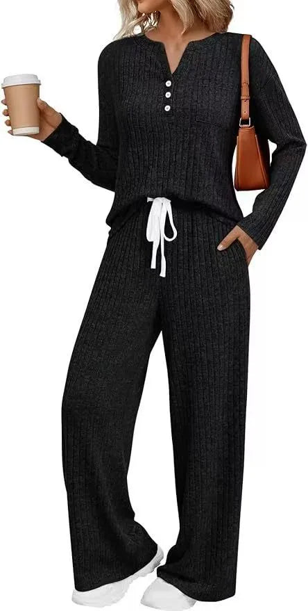 Knitted V-neck striped long coat with long sleeves, pockets, and a lace-up detail on a hanger.