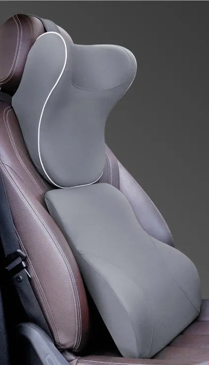 Car headrest and lumbar support cushion set in gray on a car seat