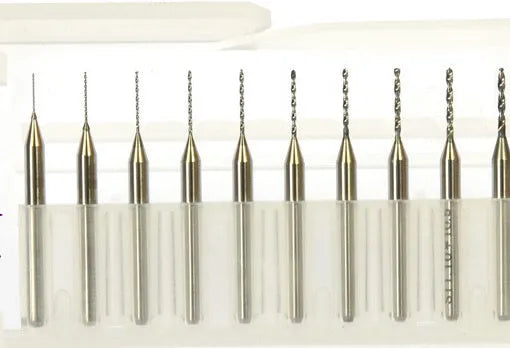 Close-up of a set of imported tungsten carbide micro-engraving bits in various sizes from 0.10mm to 2.00mm diameter.