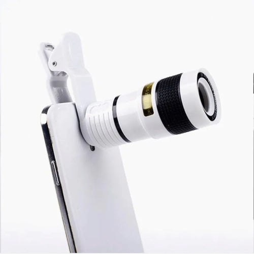 12X magnification phone telescope lens with mounting clip and cleaning cloth on a table.