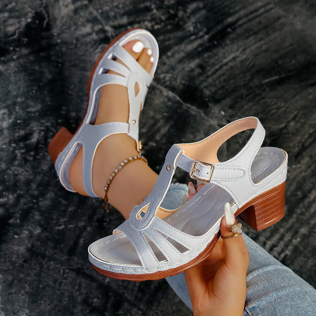 Women's black peep toe wedge platform sandals showing buckle fastening and fish mouth toe design.