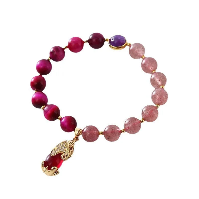 Simple women's bracelet made of transparent strawberry crystal beads on a black elastic rope.