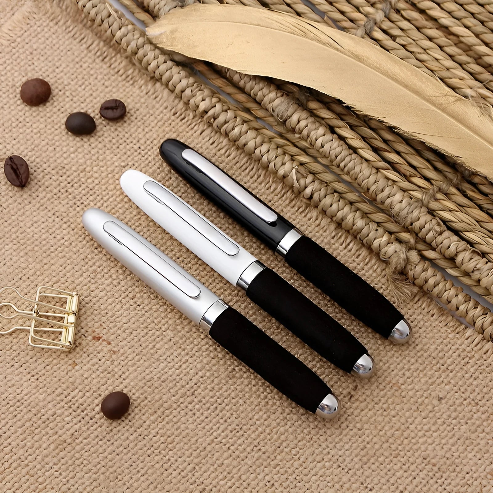 Metal ballpoint pen with bullet tip shown alongside seven refill colour options