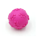 Blue TPR dog bite proof toy ball with built-in soundtrack, 6cm diameter on grass