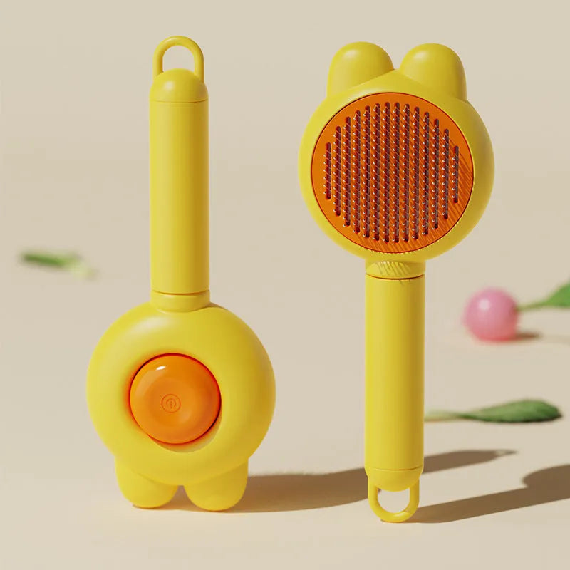 Green self-cleaning cat brush with metal comb and release button for pet grooming.