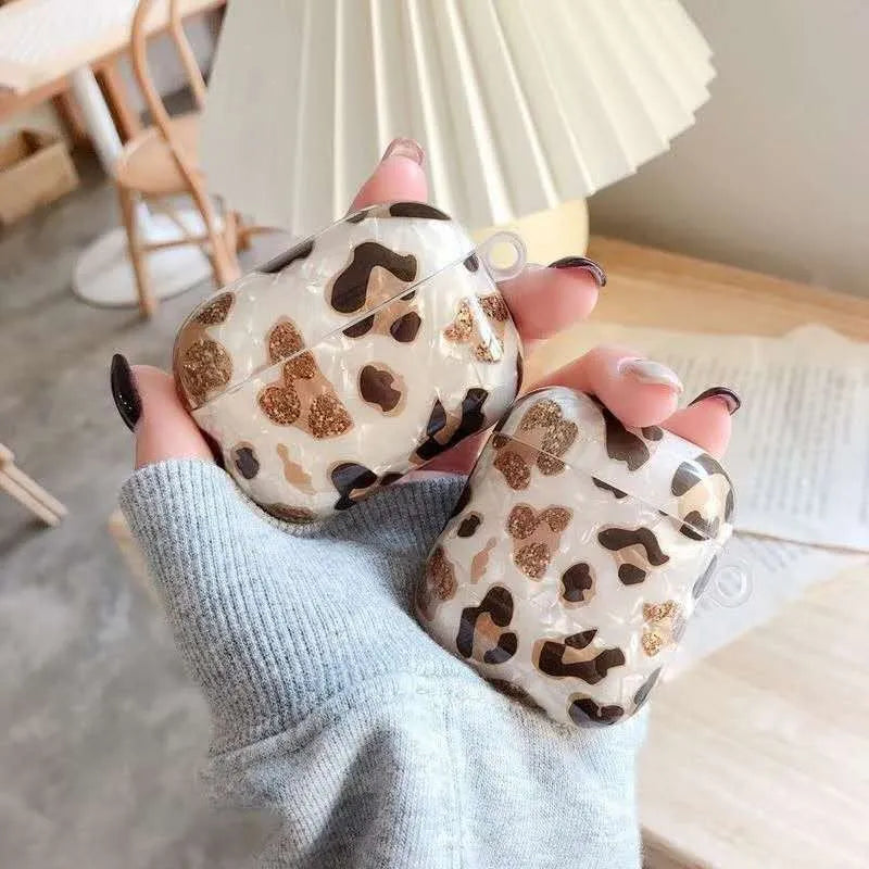 TPU protective case for Apple AirPods in leopard print, white, pink, purple, green marble, cherry shell, and water wave stripe options.