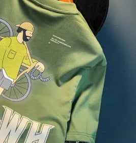 Men's green loose-fit short sleeve t-shirt with printed design on fabric, laid flat to show size.