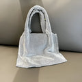 Silver rhinestone handbag with cotton thread body and open outer pocket for dinner and party use