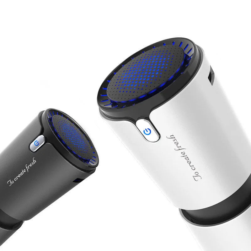Portable mini car air purifier with True HEPA filter, USB cable, compact silver cup shape on car cup holder