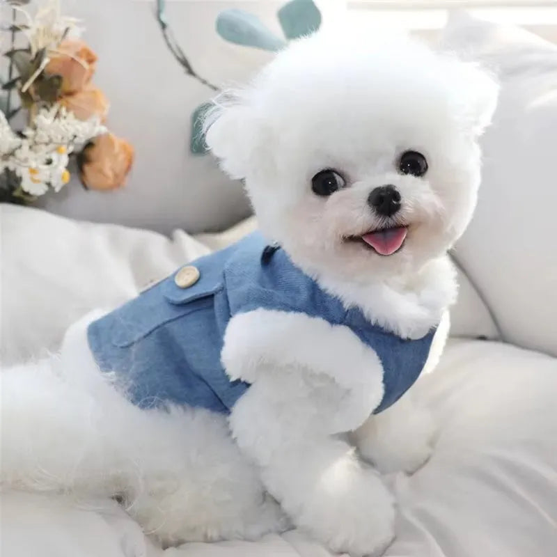 Denim blue pet vest with white wool lining, bear print, wooden buttons, and metal D-ring.