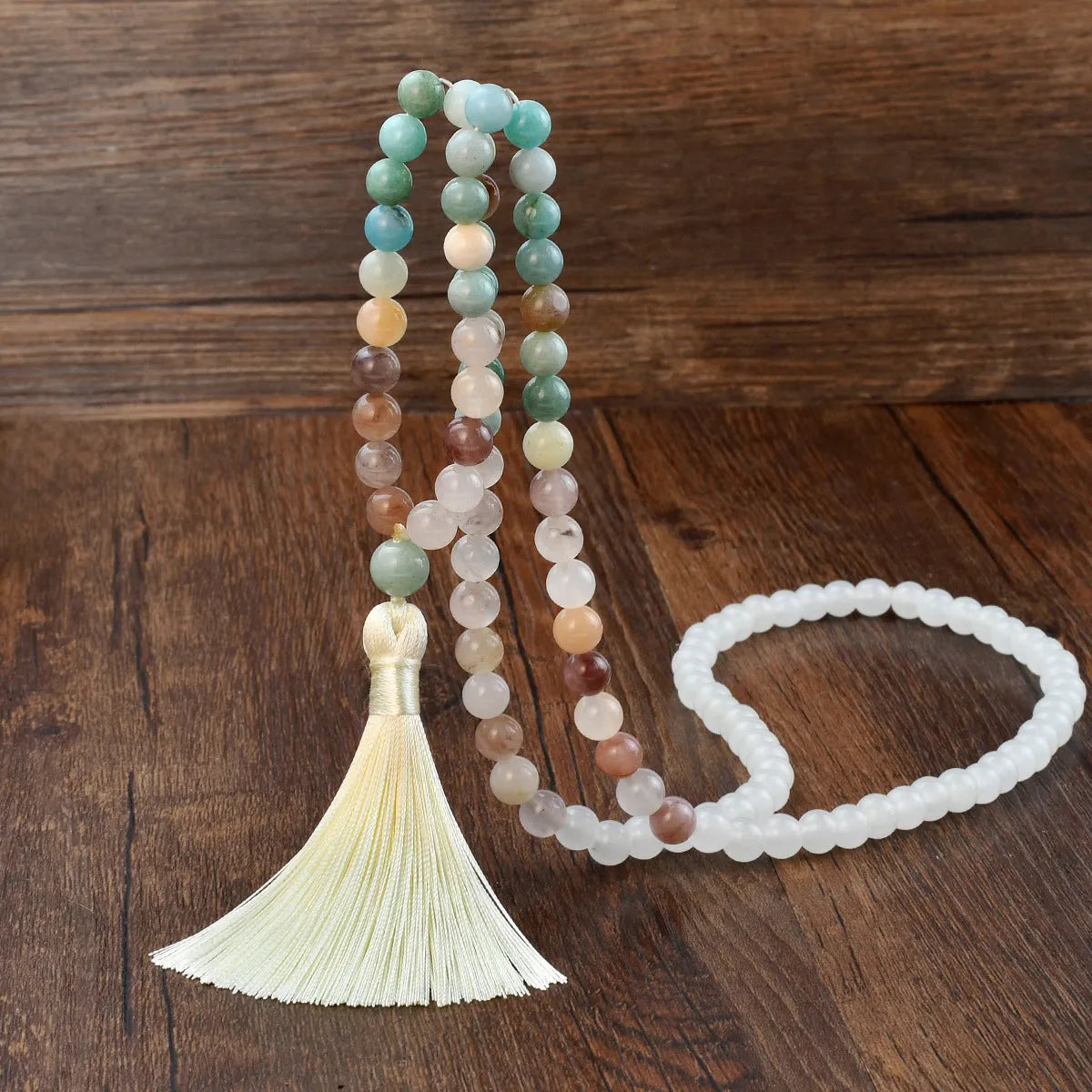 Long beaded bohemian necklace with 108 natural stones, a geometric pendant, and colourful tassels on an 81cm chain.