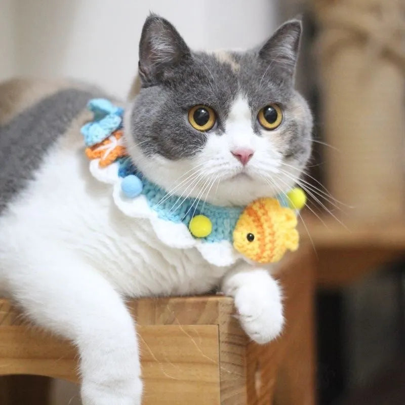 Hand-woven wool cat collar with cartoon Underwater World pattern in blue, size example on a light background