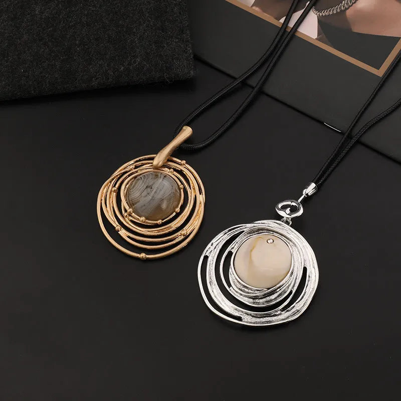 Gold geometric sweater chain necklace with adjustable snakeskin rope chain and large round pendant