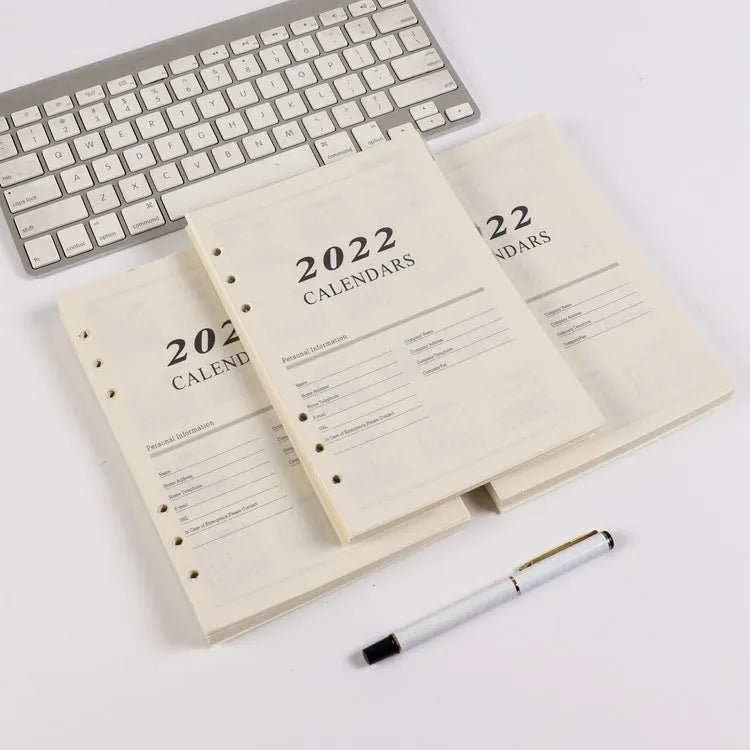 A5 loose-leaf notebook inner pages with monthly plan layout on white paper