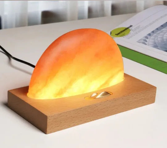 Sunrise Oriental wooden base salt lamp with integrated wireless phone charging pad and natural crystal salt shade.