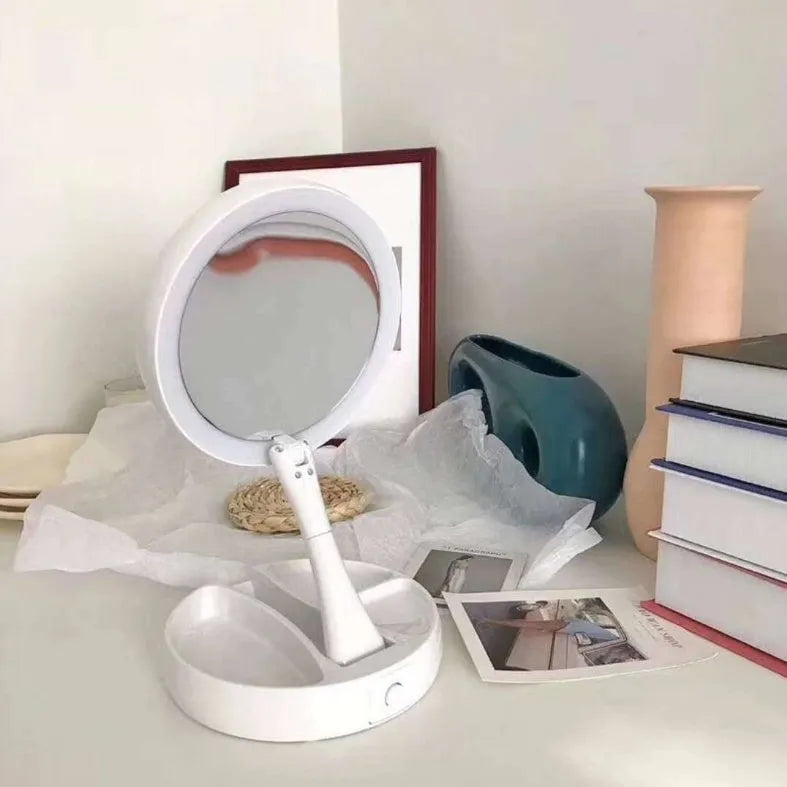 White foldable LED vanity mirror with storage compartments and USB charging port