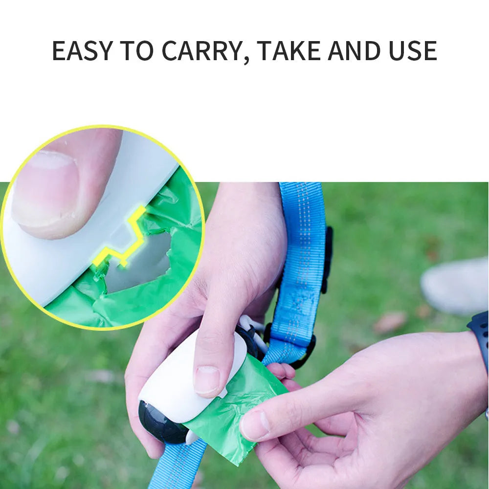 White and grey space capsule dog poop bag dispenser clipped to a leash with translucent ends showing bags inside