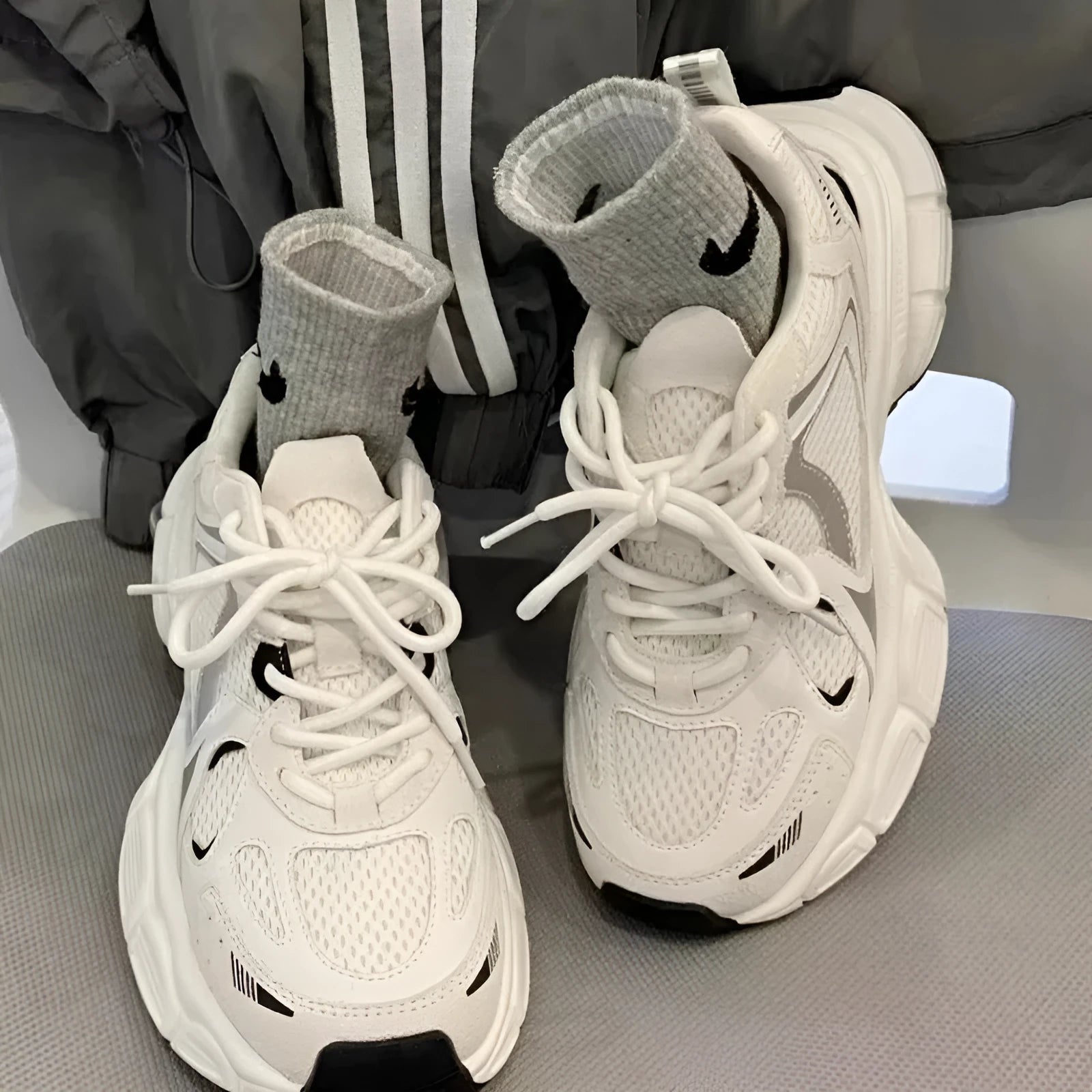 Beige mesh platform sports shoes with a wedge heel and lace-up front.