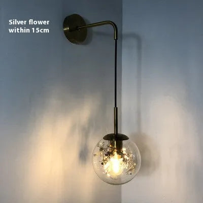 Modern simple glass wall-mounted bedside lamp in golden or silver finish.