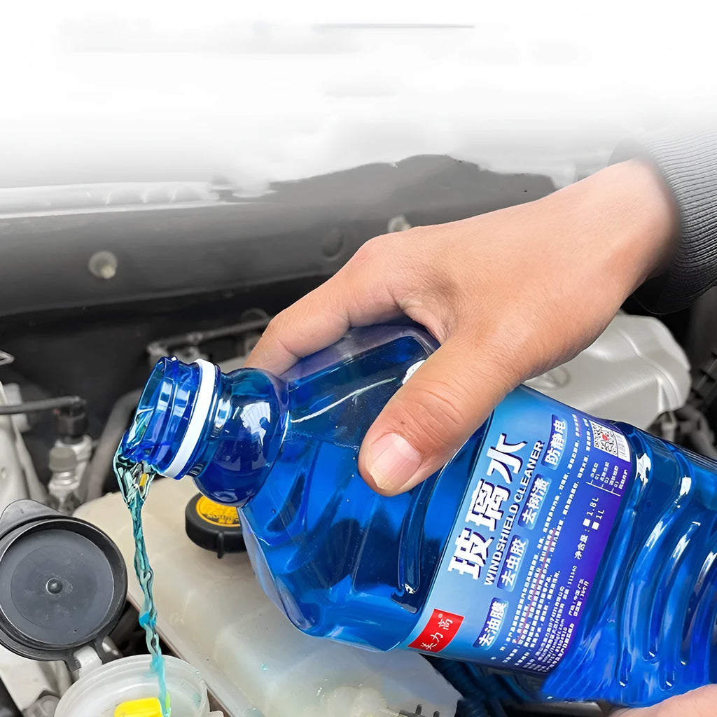 Blue windshield washer fluid in 1.8L bottle with car wiper application