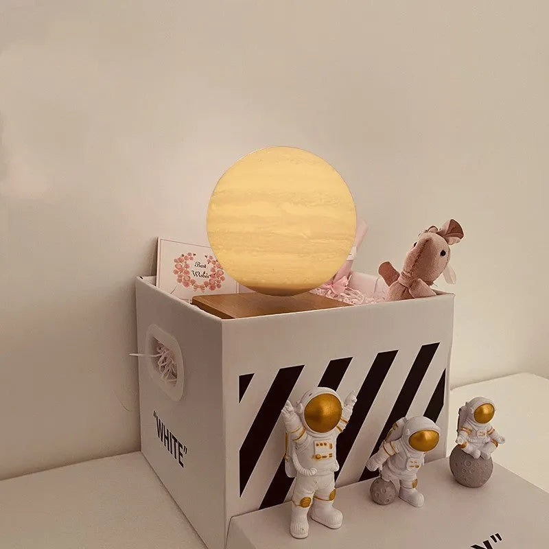 Maglev floating moon night light with LED illumination and astronaut figurines