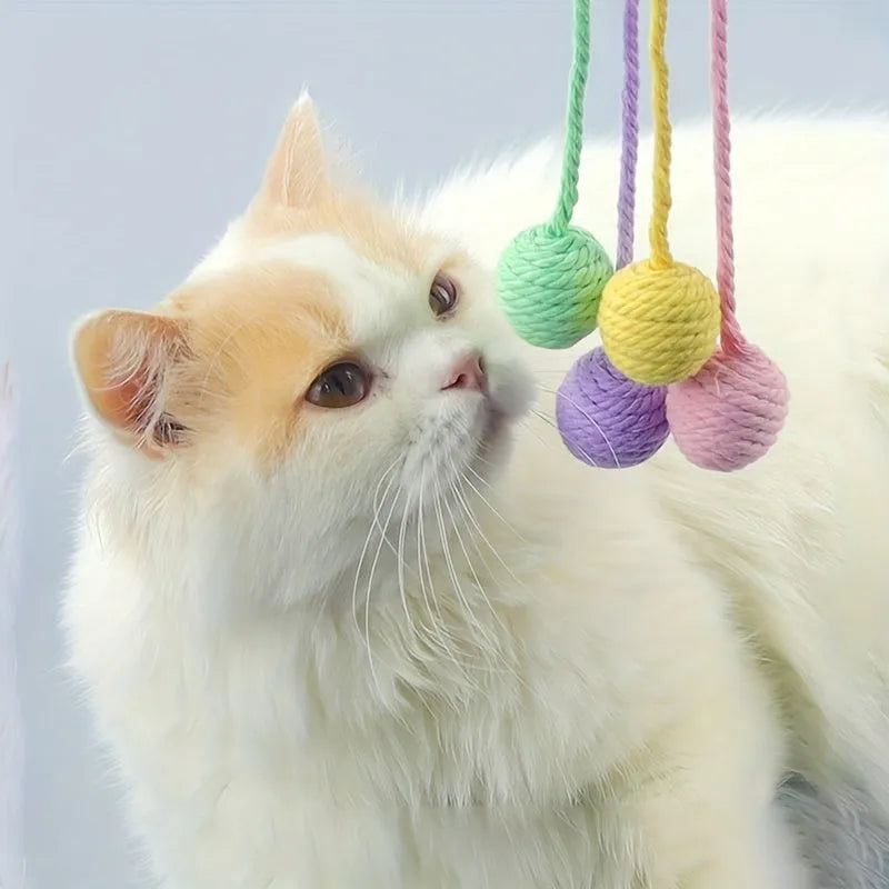 Colourful cat toy ball with attached rope and internal bell in green, pink, purple, and yellow options