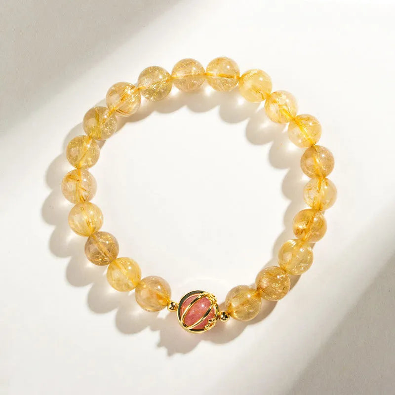 Gold rutilated quartz bracelet with diamond-cut beads in two size options