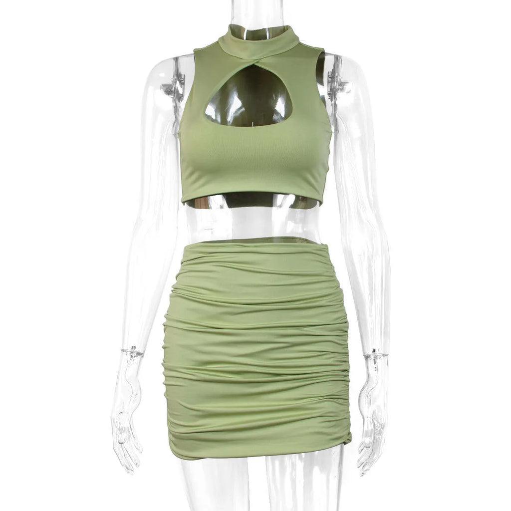 Women's light purple hollow vest and matching split hip skirt two-piece set on a mannequin