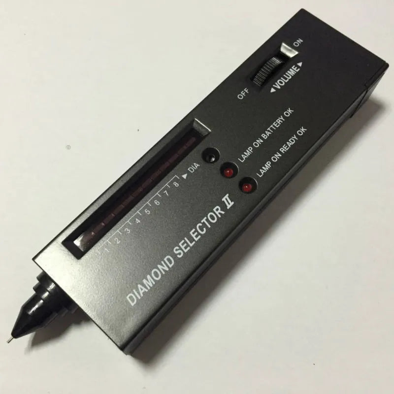 Second generation black diamond thermal conductivity tester with metal probe for gem identification.