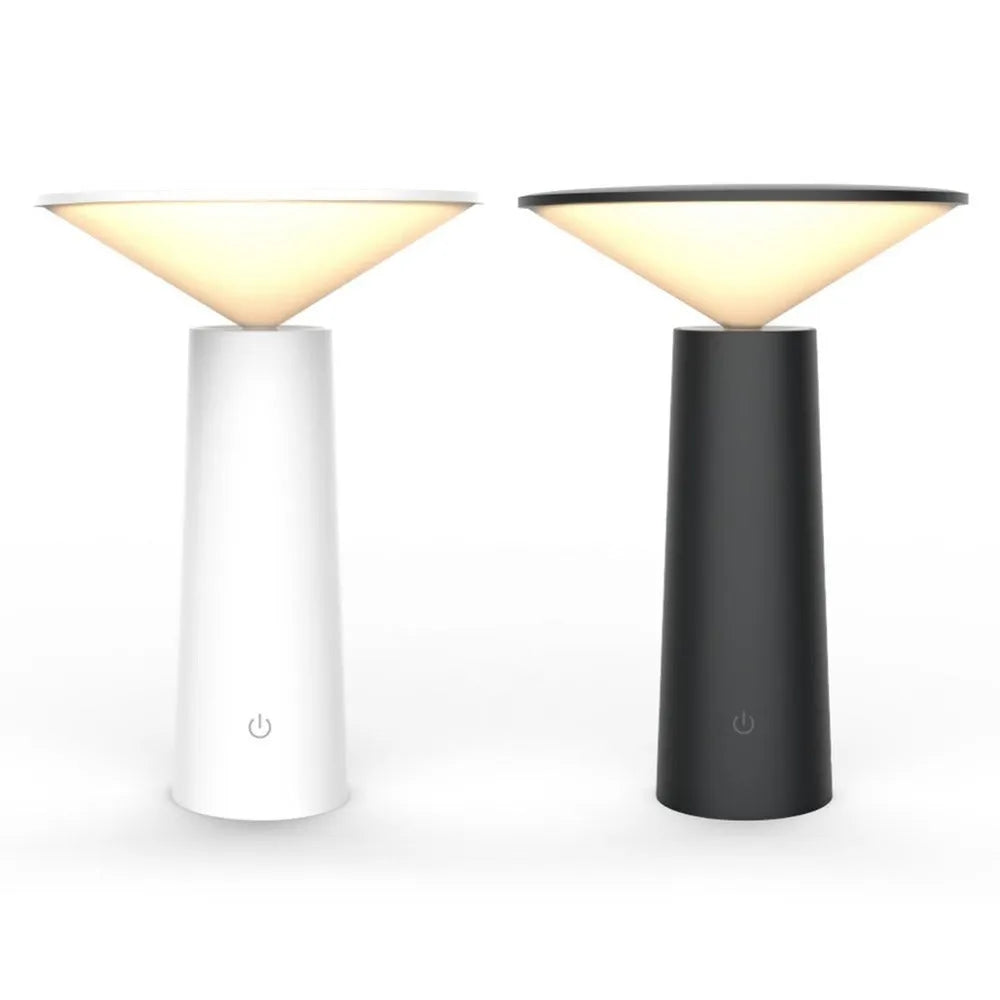 Black USB rechargeable table lamp with adjustable LED reading light head on a desk.
