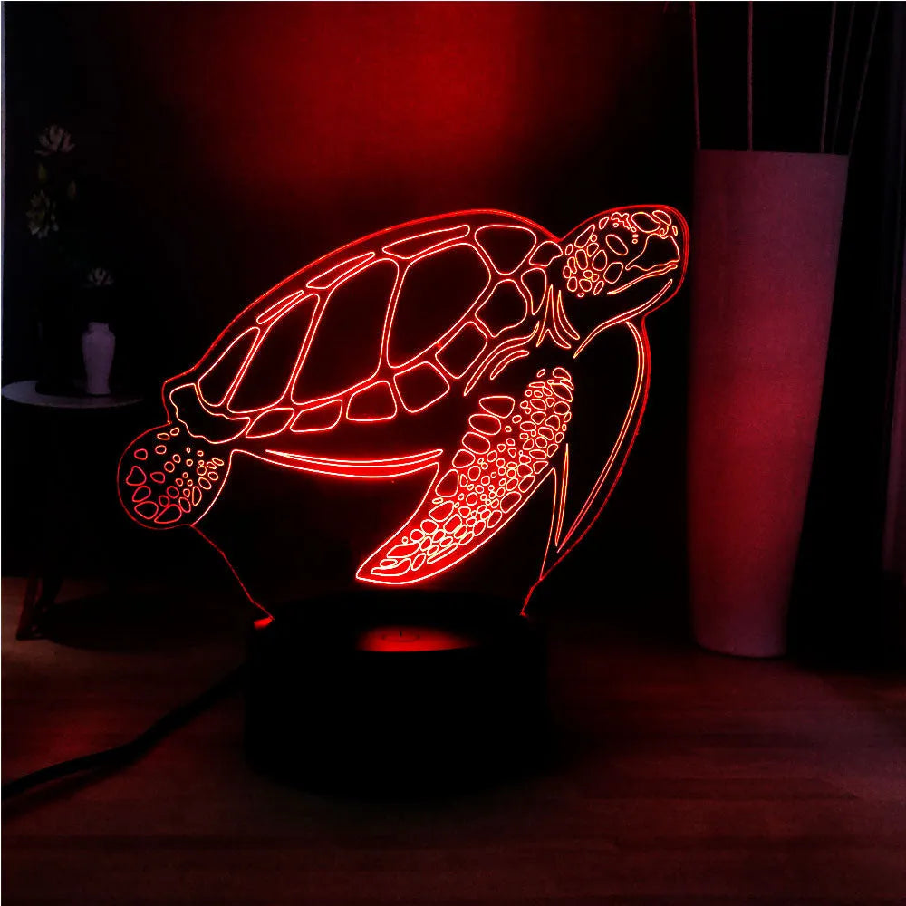 3D green turtle shaped LED night light on a table, showing multi-colour glow from its acrylic shell.