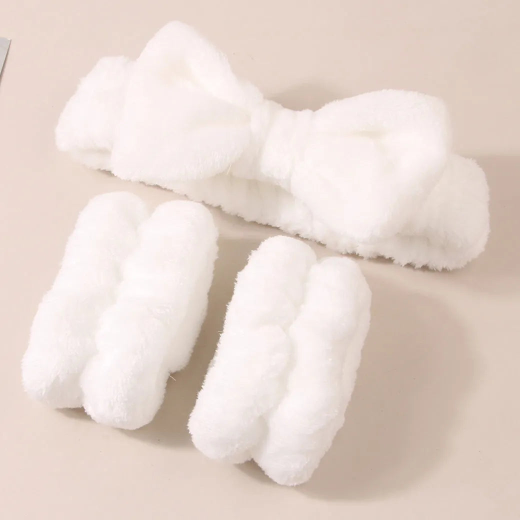 Facial brush set with coral fleece hair band and four nylon brush heads in purple grey white pink colours