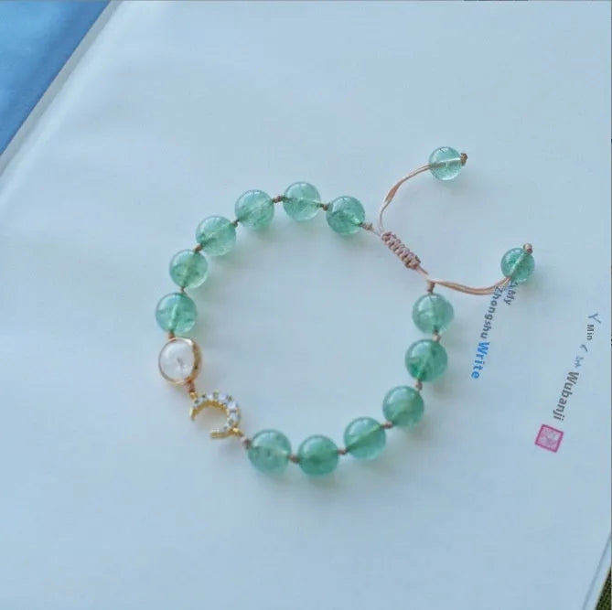 Handcrafted strawberry quartz crystal bracelet with Hetian jade peach blossom charms