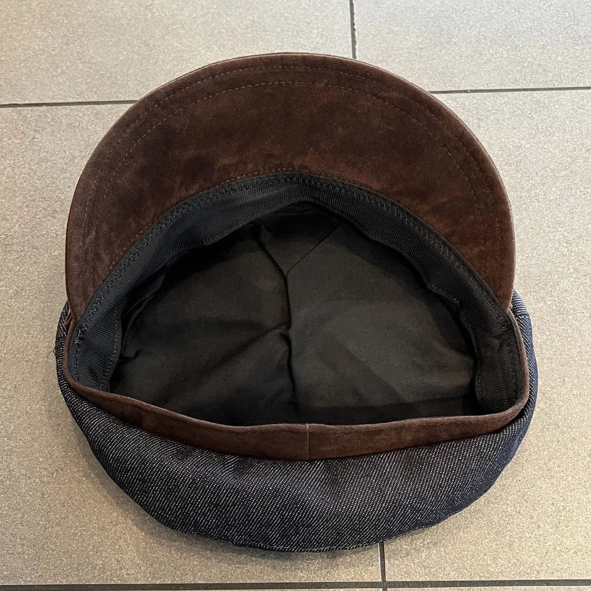 Dark blue denim octagonal newsboy hat with adjustable sizing for 54-58cm head circumference