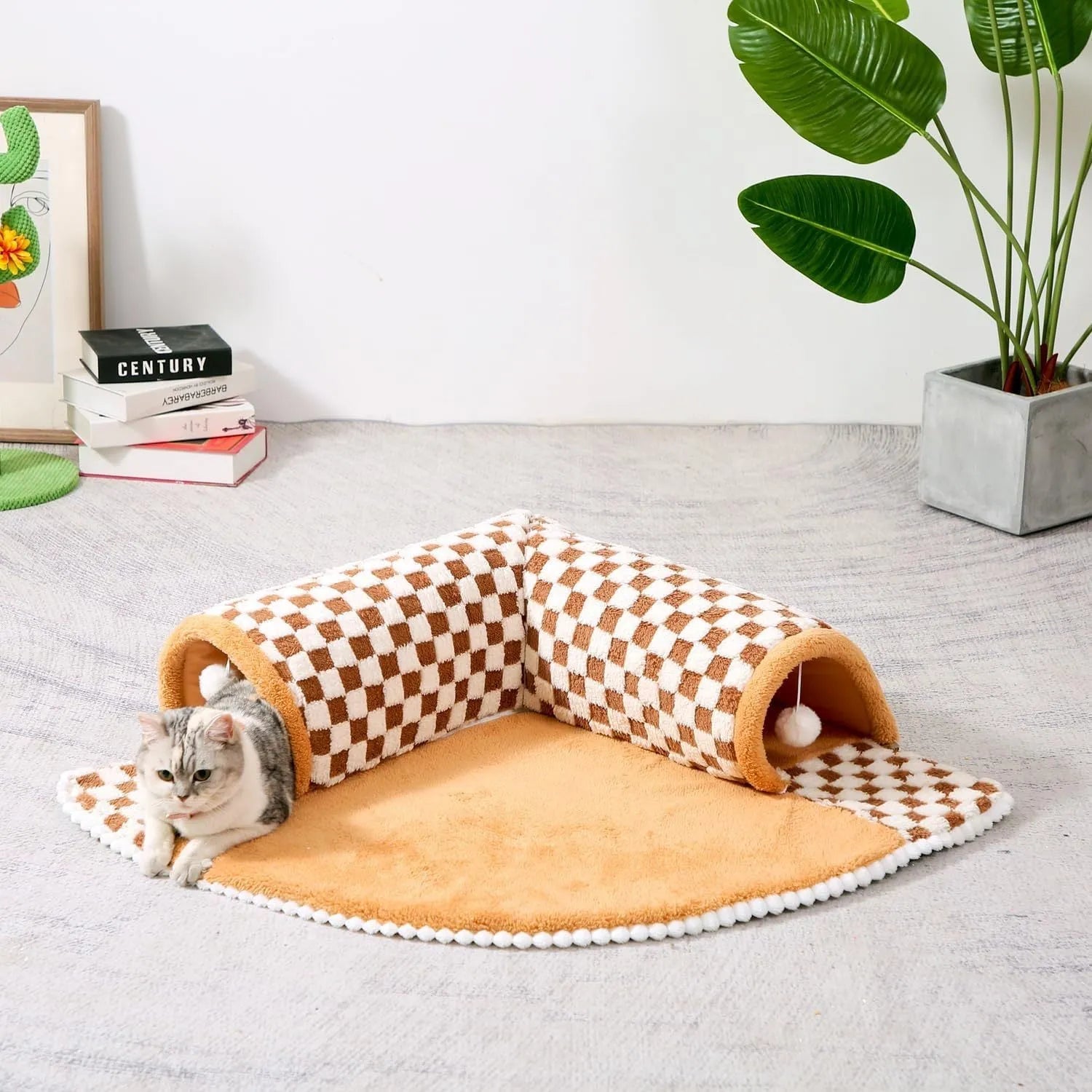 Coffee coloured plush fan-shaped pet bed with attached tunnel, showing anti-slip base.