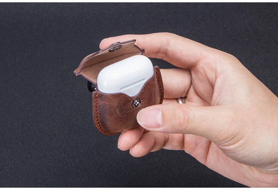 Crazy horse cowhide leather AirPods cover with keychain and charging hole, 6.8cm x 12.3cm, in blue, brown, coffee, or red.