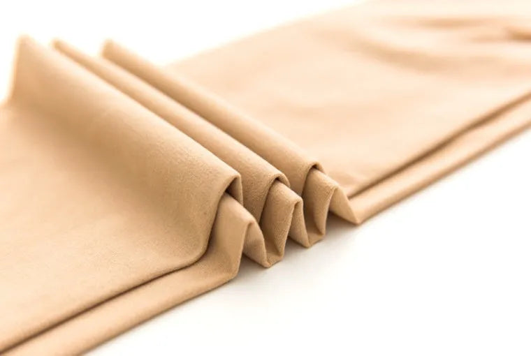 Beige and black stovepipe shaping socks for hips and abdomen compression