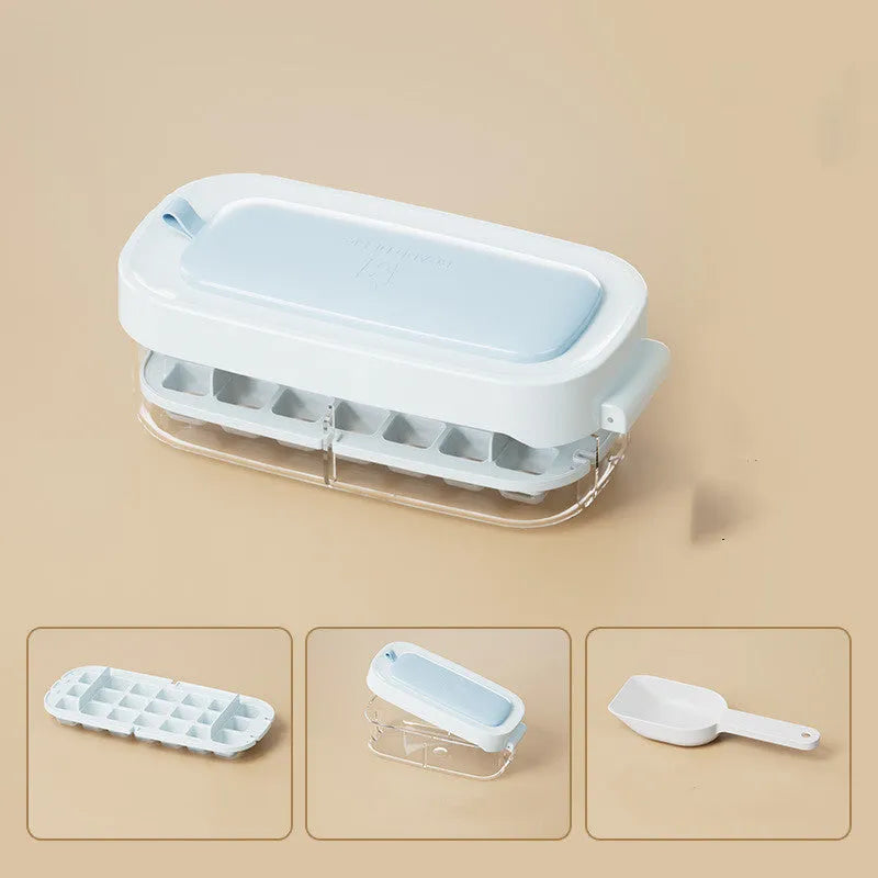 High capacity blue ice cube tray with ice grid and attached storage for the included shovel.