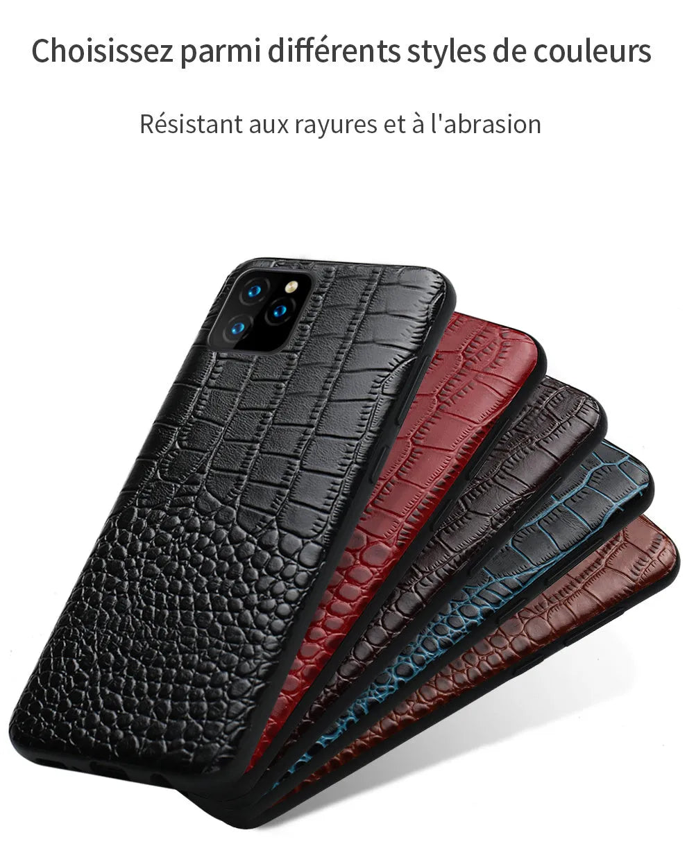 Handmade black leather iPhone case with a crocodile pattern texture on a table.