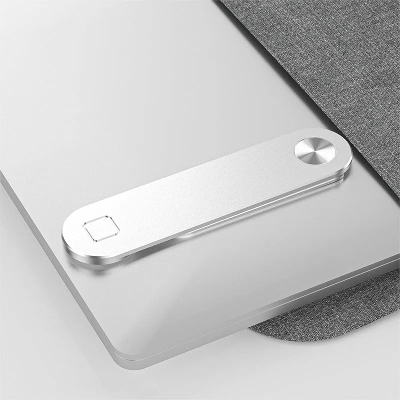 Black aluminum laptop phone holder clipped to a monitor, holding a smartphone and with headphones hanging from the hook.