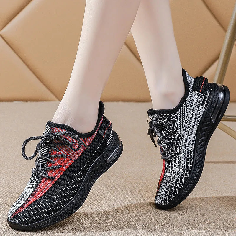 Women's casual running shoes in purple, black and orange colours with round toe and lace-up design