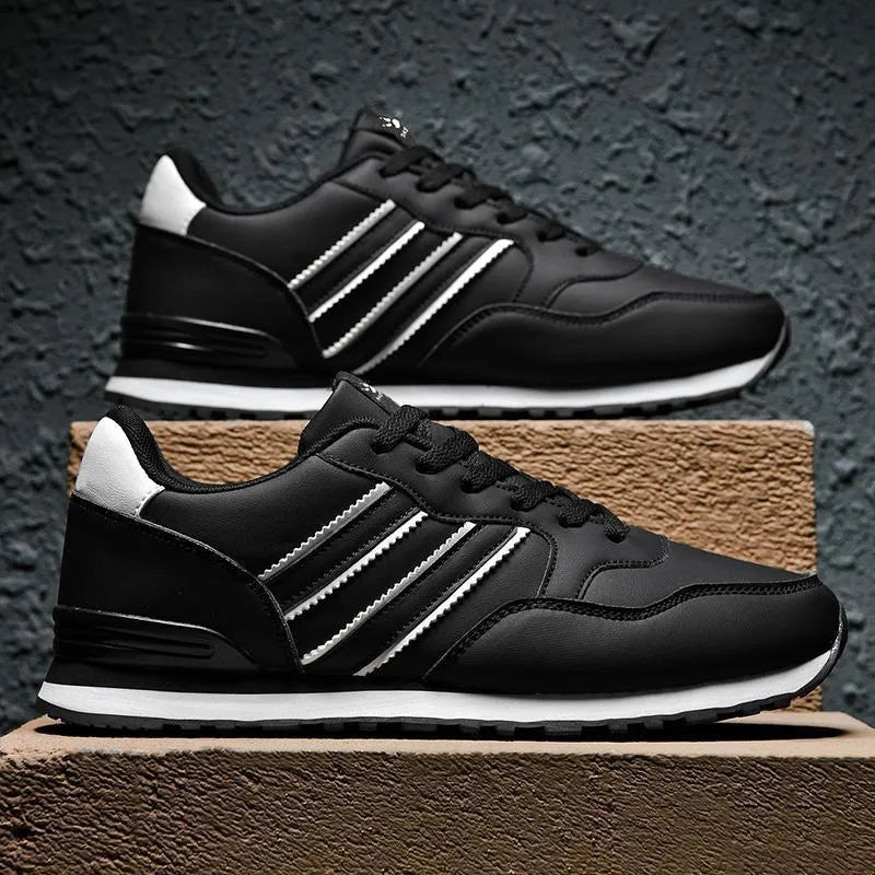 Men's casual running sports shoes with carved wing pattern in black and white space leather