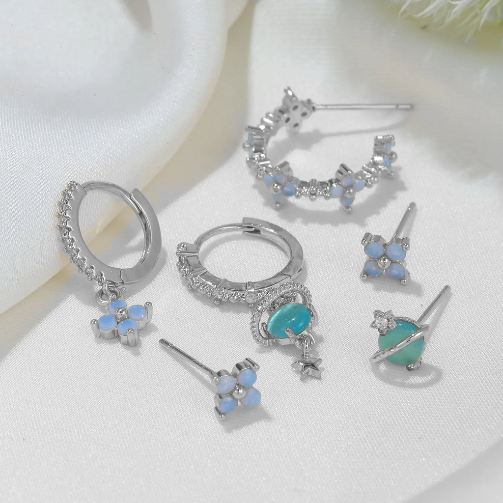 Gold and silver flower stud earrings with zircon detail in Japanese Korean sweet girl style.