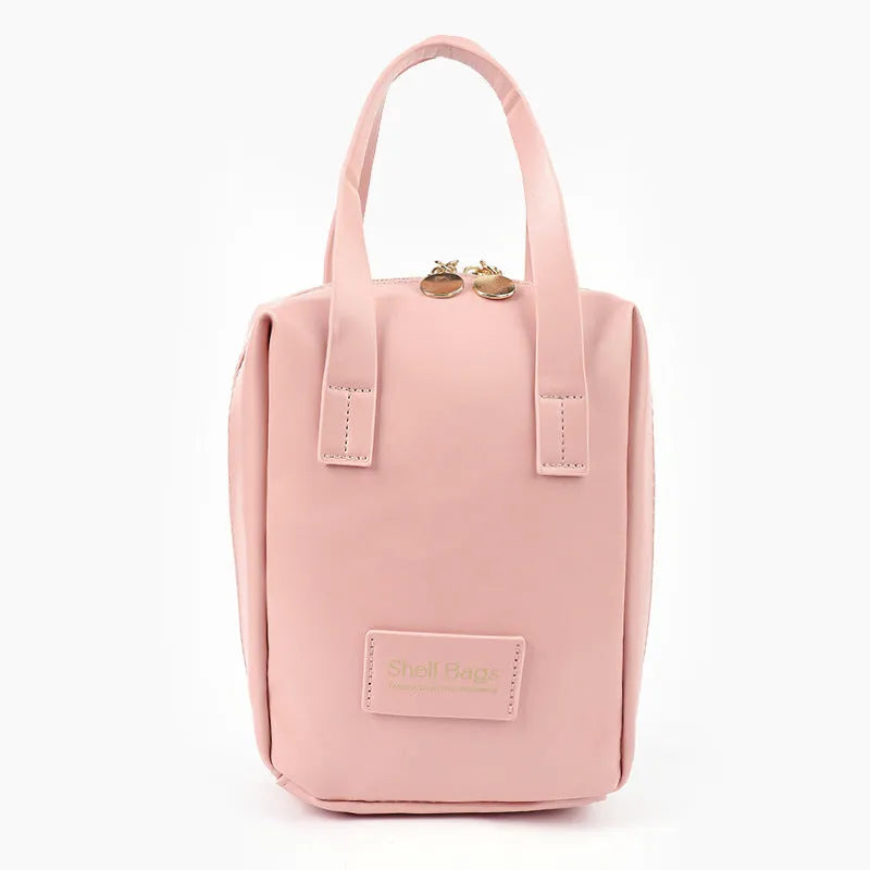 Girly heart egg shell waterproof makeup bag in solid pink with sewing line detail, 15x8x18cm, open to show PU lining