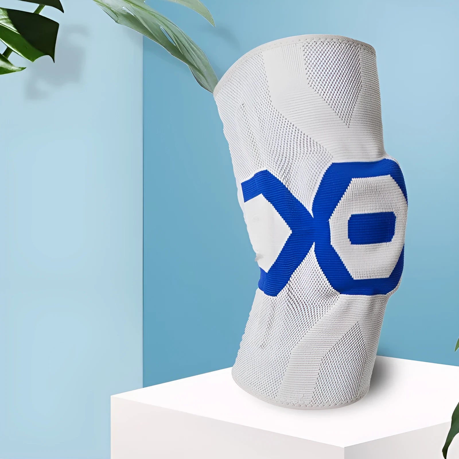 A pair of flexible silicone knee pads for sports, shown in a black and blue colour combination.
