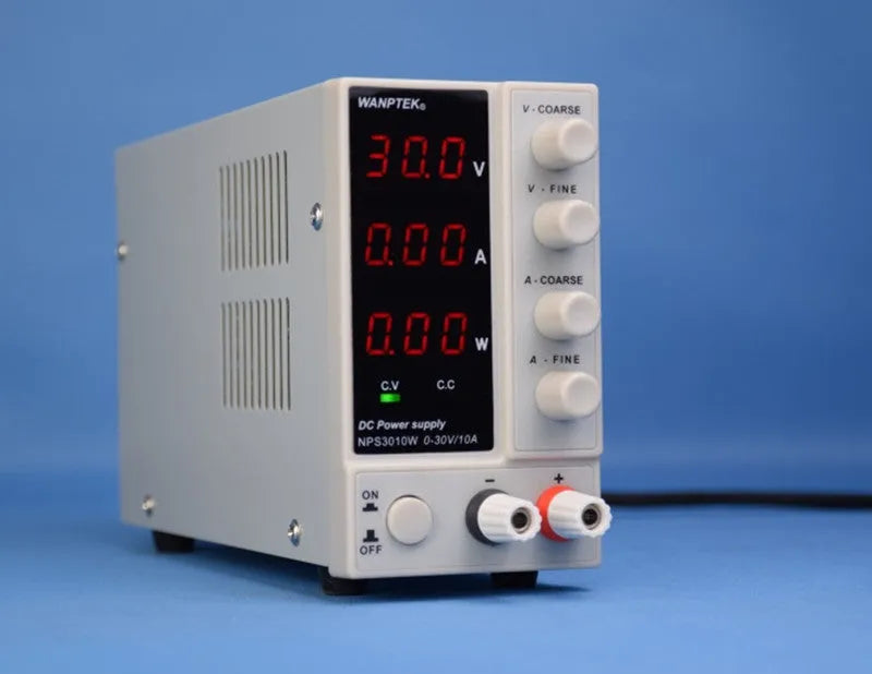 White NPS605W adjustable DC lab power supply with digital display for electronic device repair.